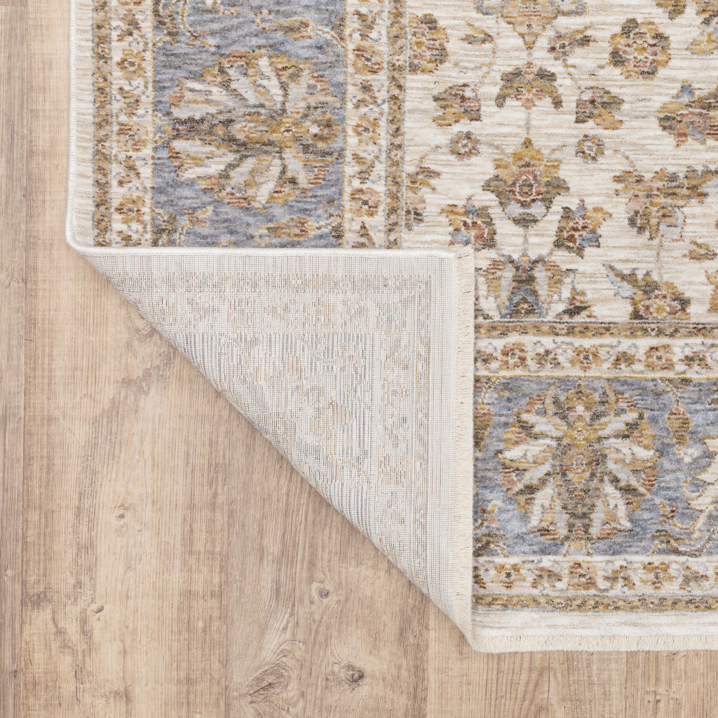 3" X 5" Ivory And Blue Oriental Power Loom Stain Resistant Area Rug With Fringe