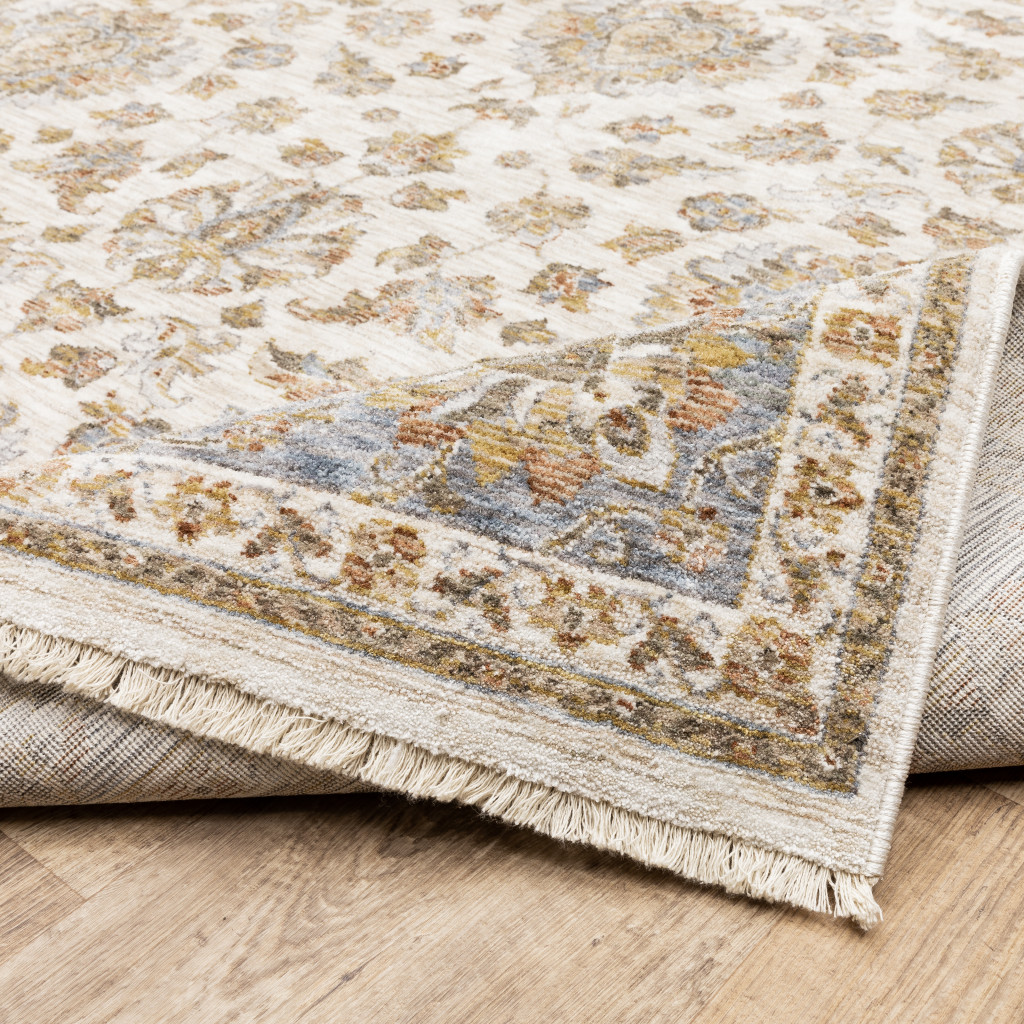 3" X 5" Ivory And Blue Oriental Power Loom Stain Resistant Area Rug With Fringe