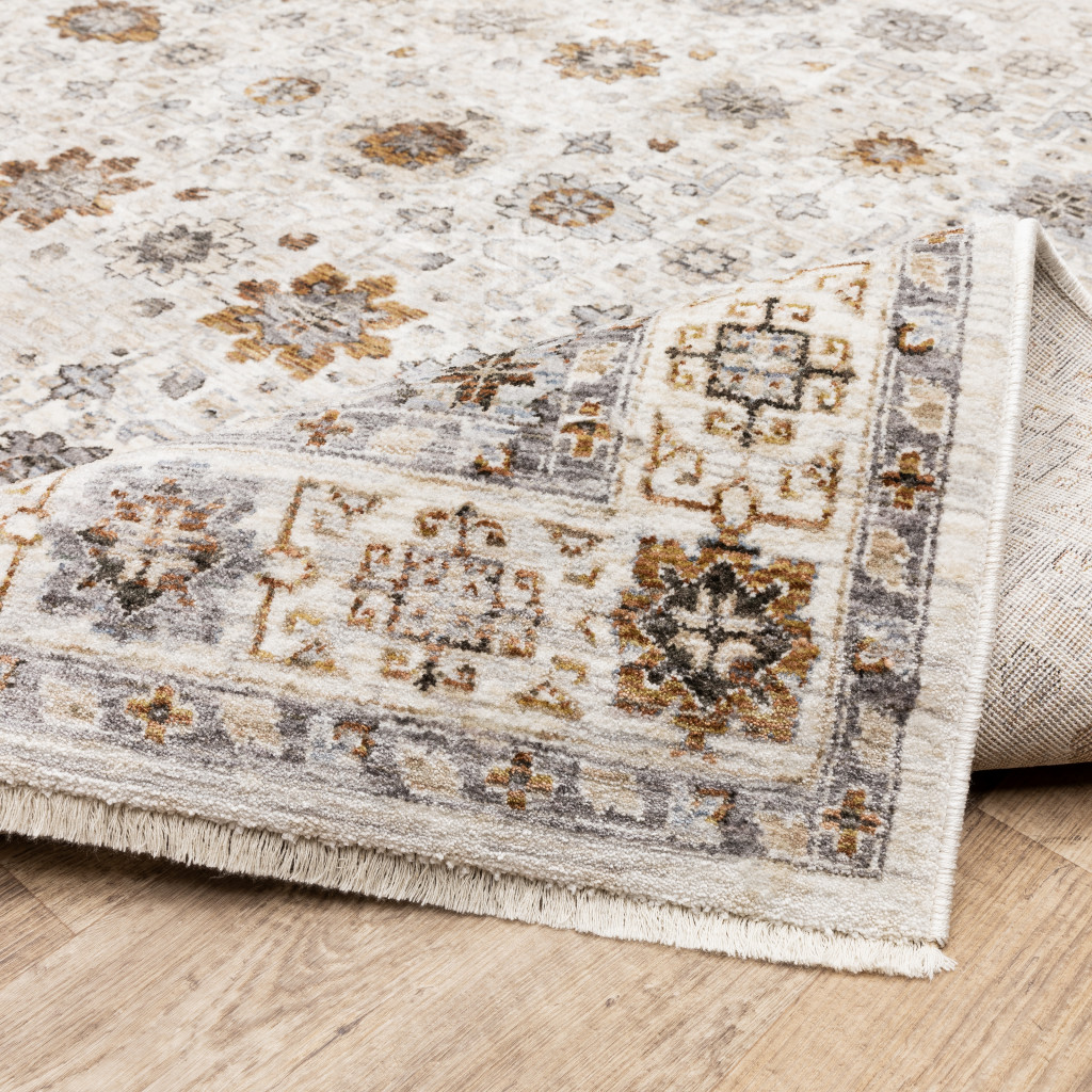 2" X 8" Ivory And Gold Oriental Power Loom Stain Resistant Runner Rug With Fringe