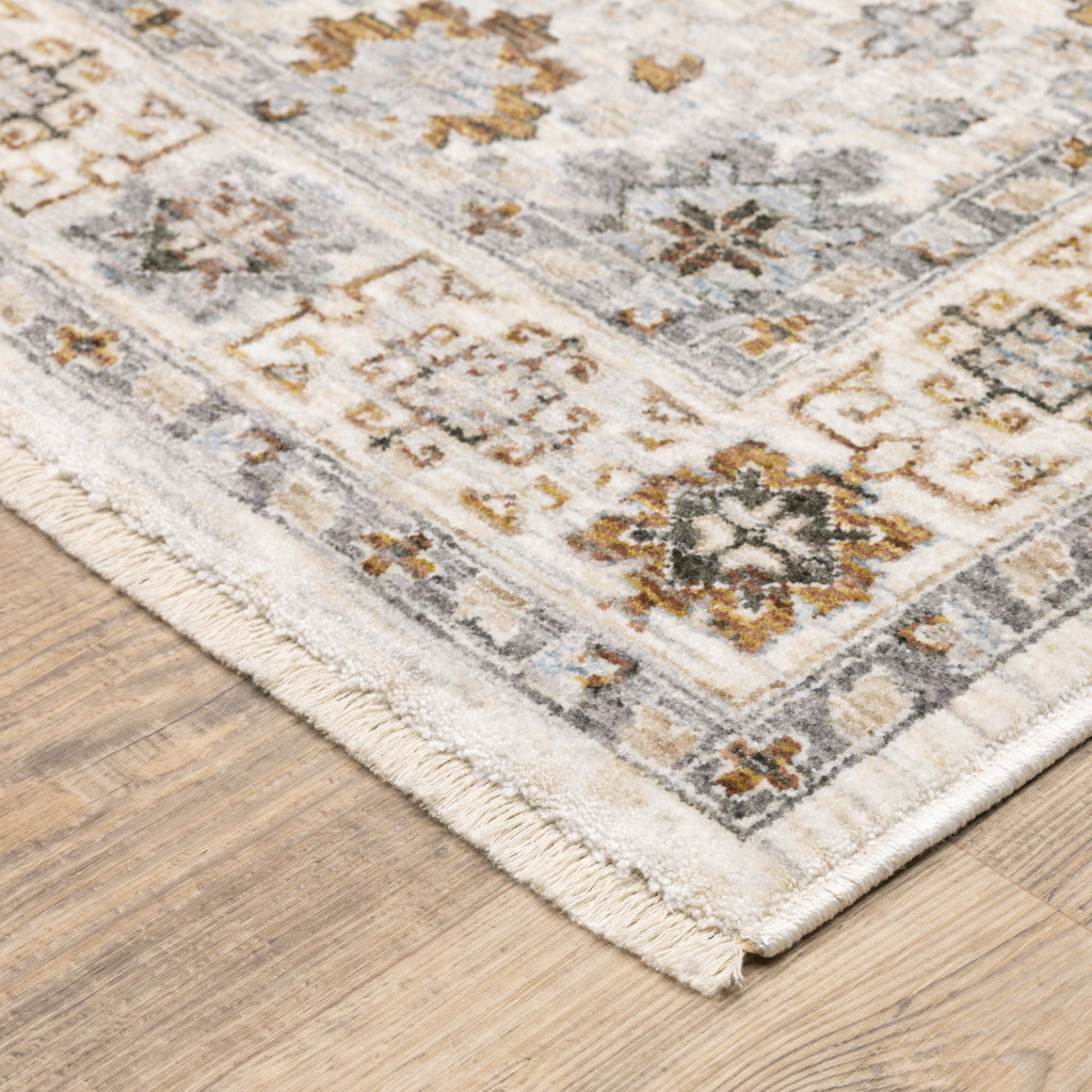 6" X 9" Ivory And Gold Oriental Power Loom Stain Resistant Area Rug With Fringe