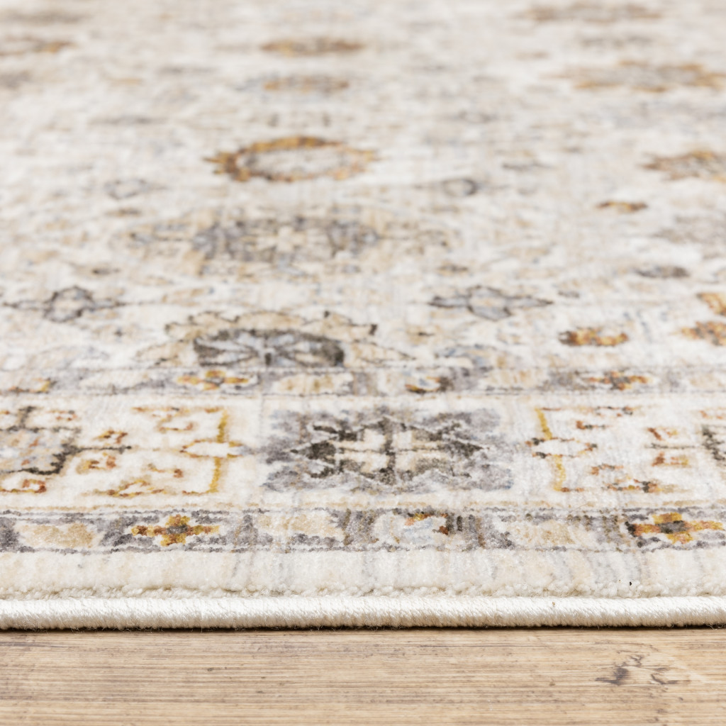 6" X 9" Ivory And Gold Oriental Power Loom Stain Resistant Area Rug With Fringe