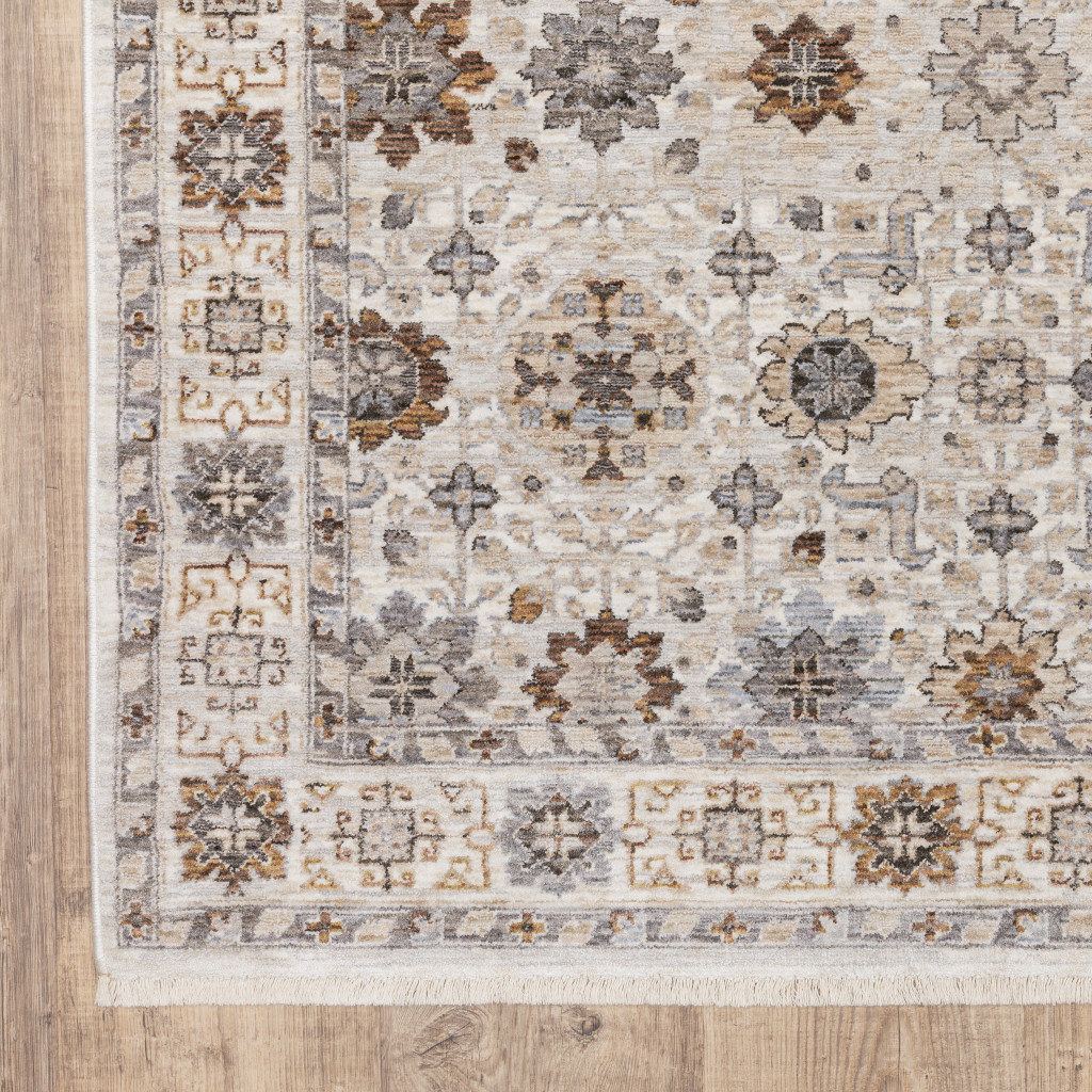 6" X 9" Ivory And Gold Oriental Power Loom Stain Resistant Area Rug With Fringe