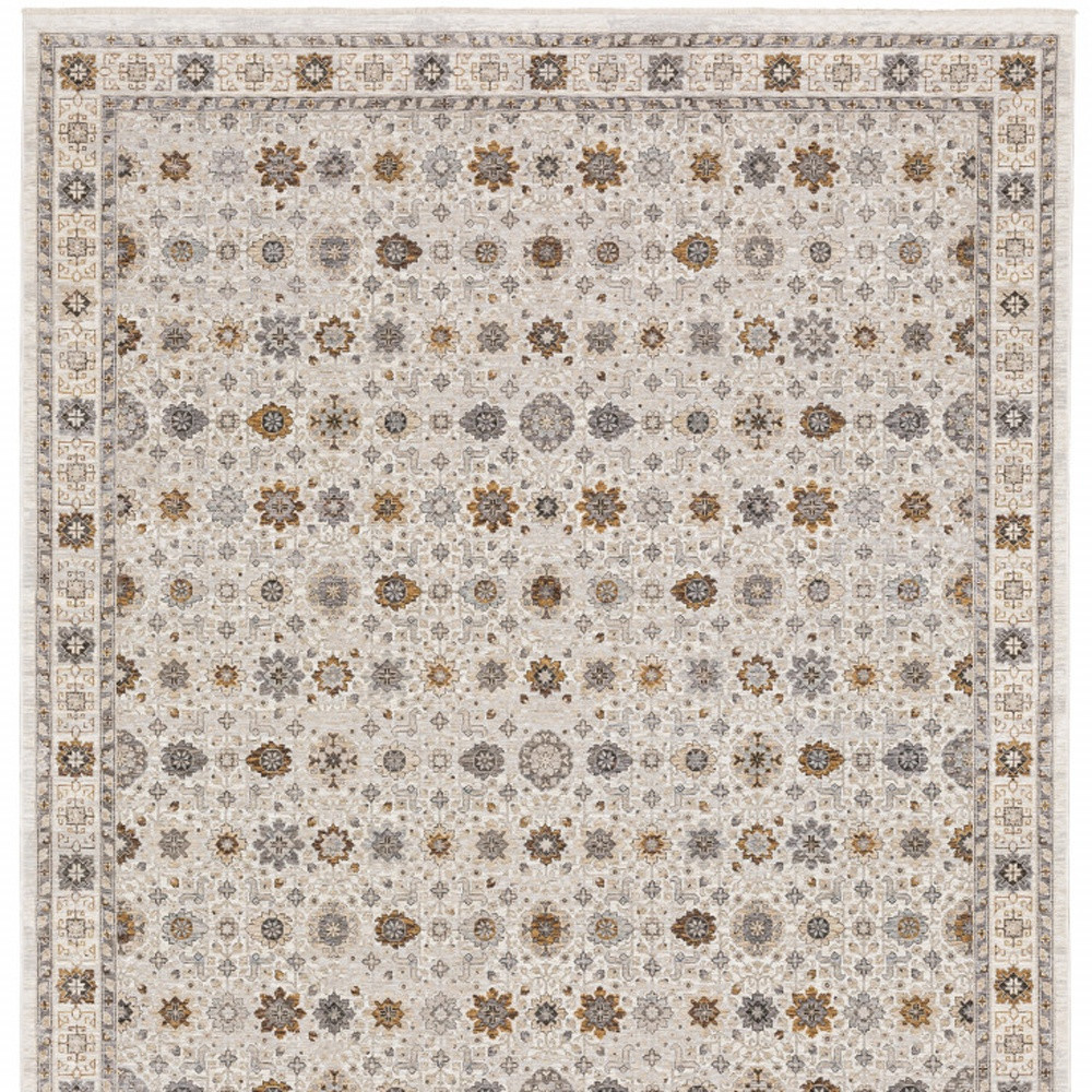 8" X 11" Ivory And Gold Oriental Power Loom Stain Resistant Area Rug With Fringe