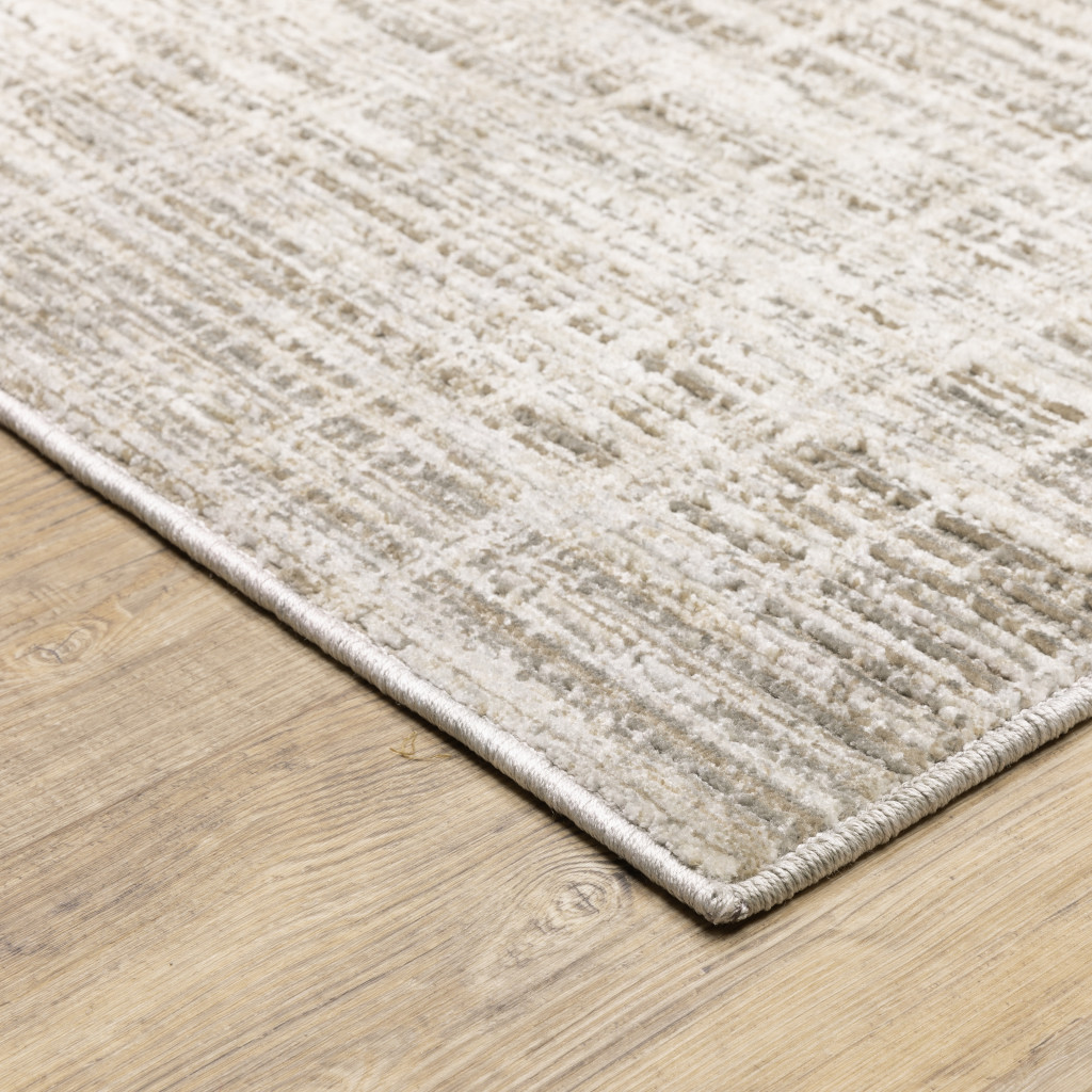 2" X 8" Beige Grey Ivory Tan And Brown Abstract Power Loom Stain Resistant Runner Rug