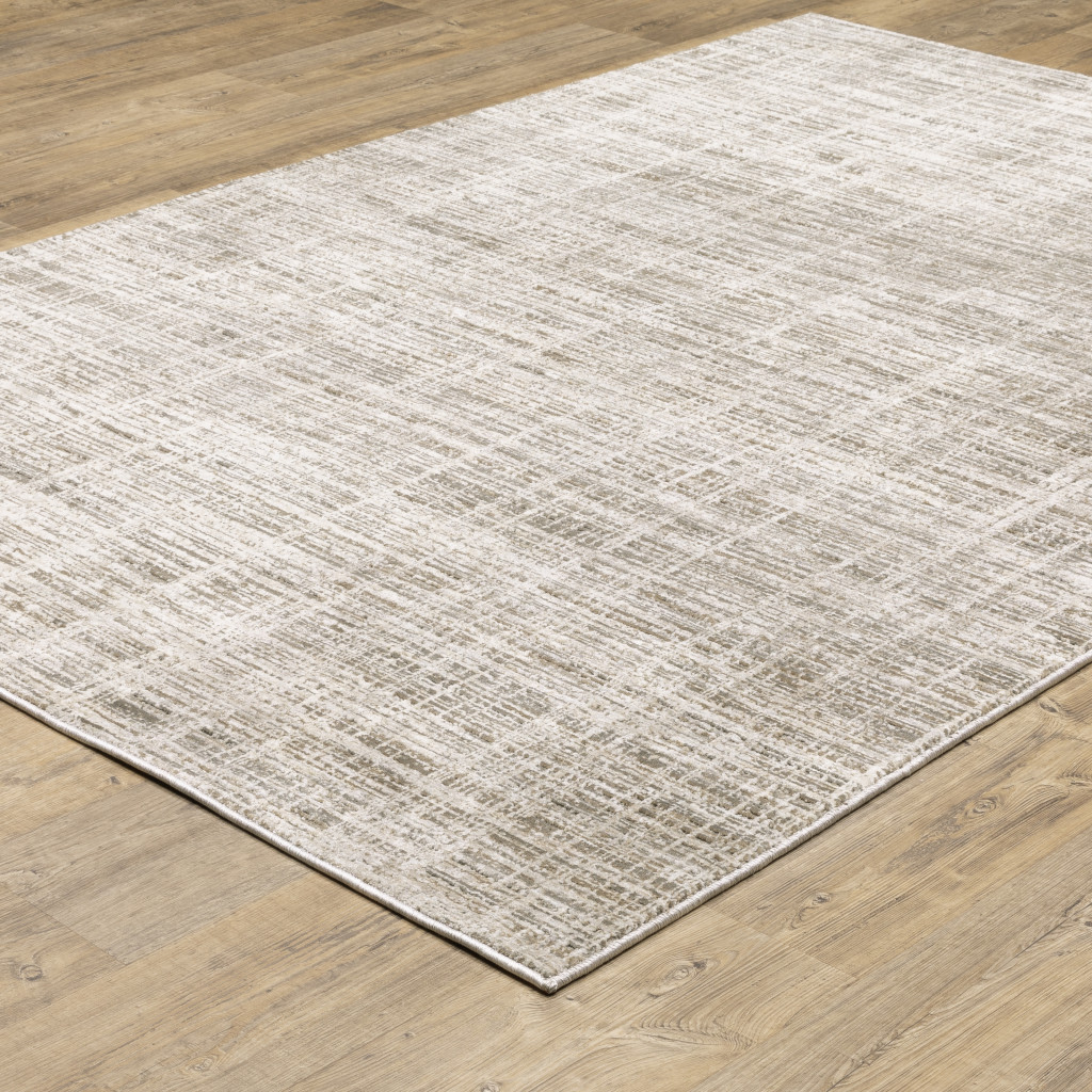 3" X 5" Beige Grey Ivory Tan And Brown Abstract Power Loom Stain Resistant Area Rug