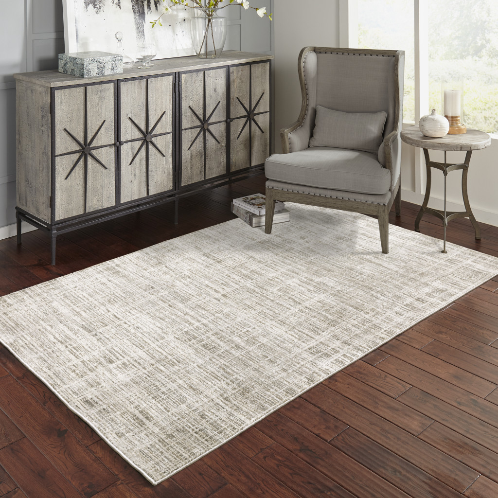 6" X 9" Beige Grey Ivory Tan And Brown Abstract Power Loom Stain Resistant Area Rug