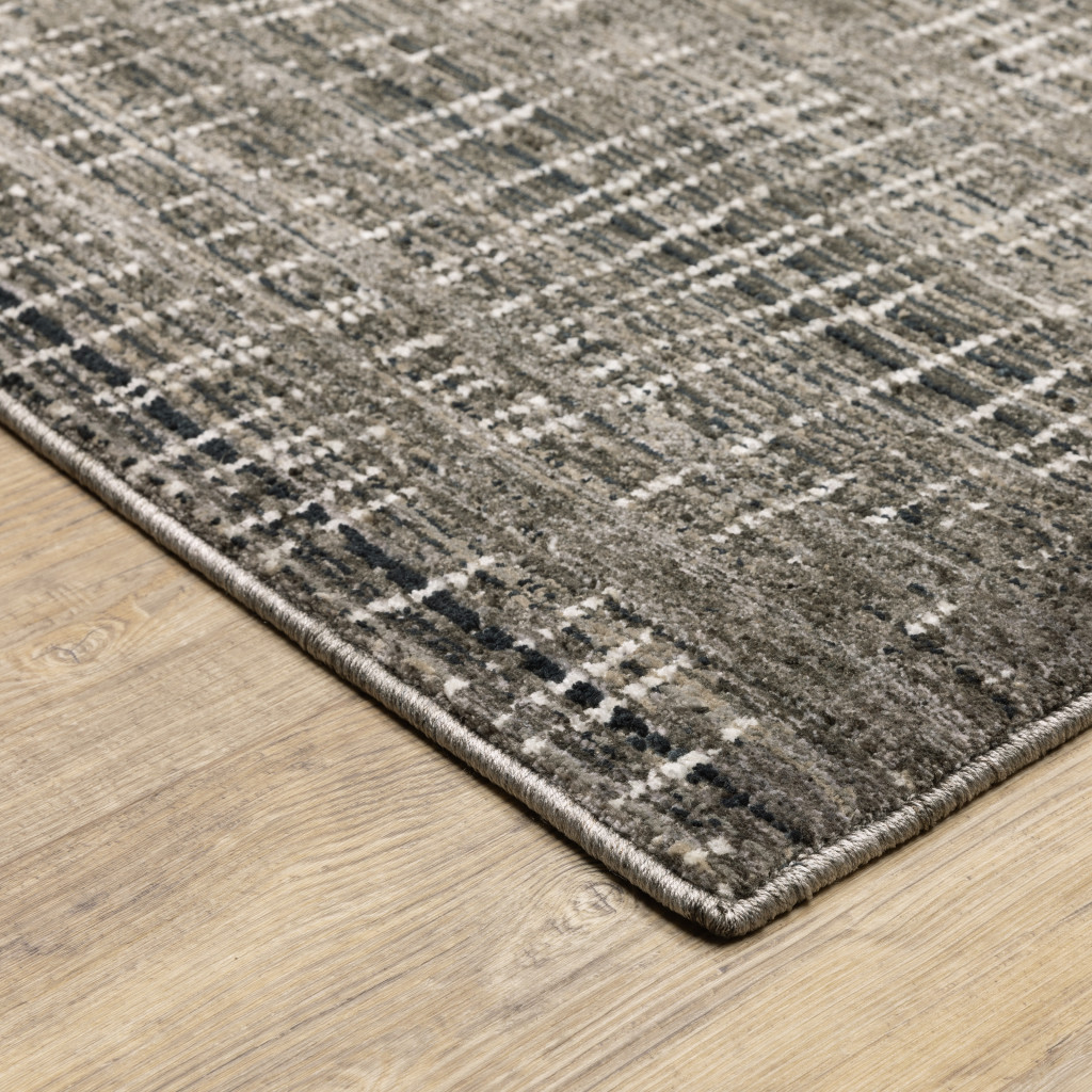 7" X 10" Gray and Ivory Abstract Power Loom Area Rug