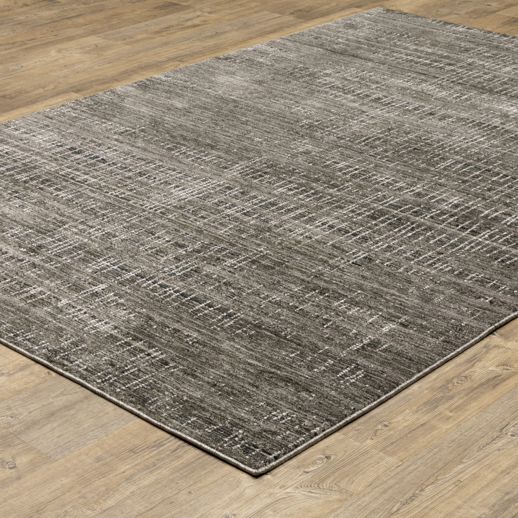 7" X 10" Gray and Ivory Abstract Power Loom Area Rug