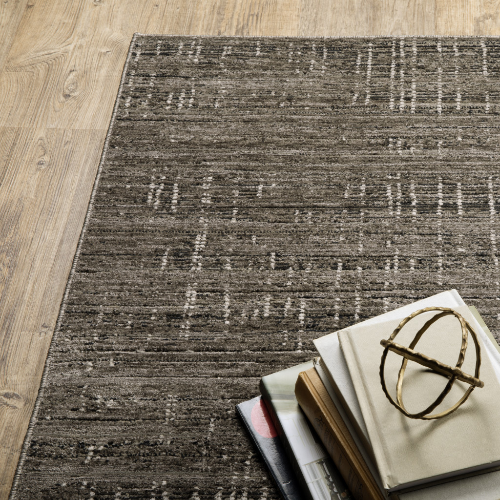 7" X 10" Gray and Ivory Abstract Power Loom Area Rug