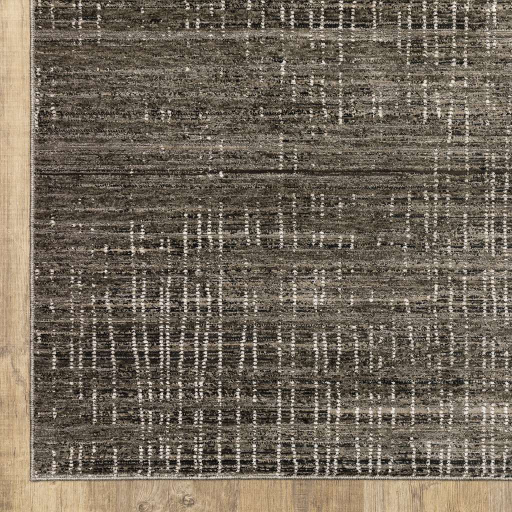 7" X 10" Gray and Ivory Abstract Power Loom Area Rug
