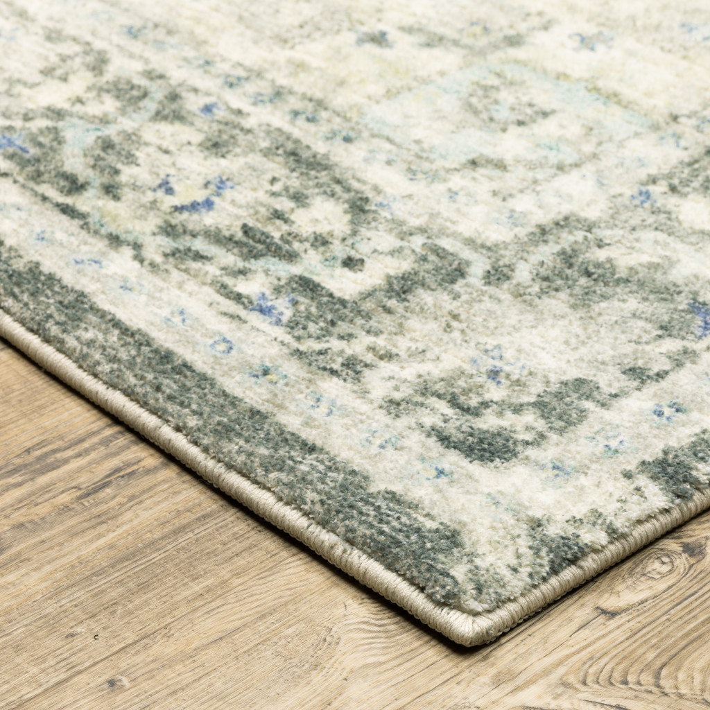 5" X 7" Grey Ivory And Blue Oriental Power Loom Stain Resistant Area Rug