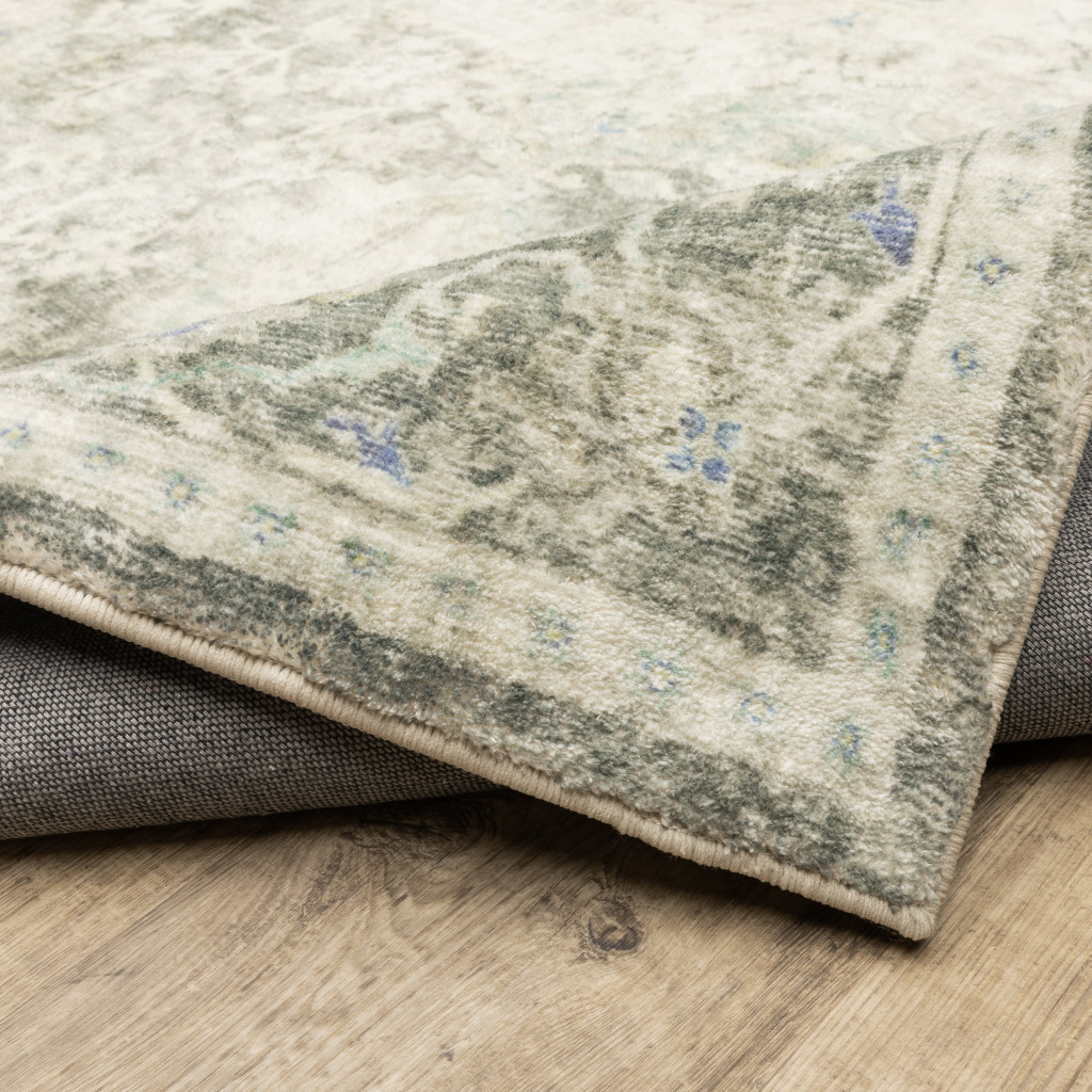 5" X 7" Grey Ivory And Blue Oriental Power Loom Stain Resistant Area Rug