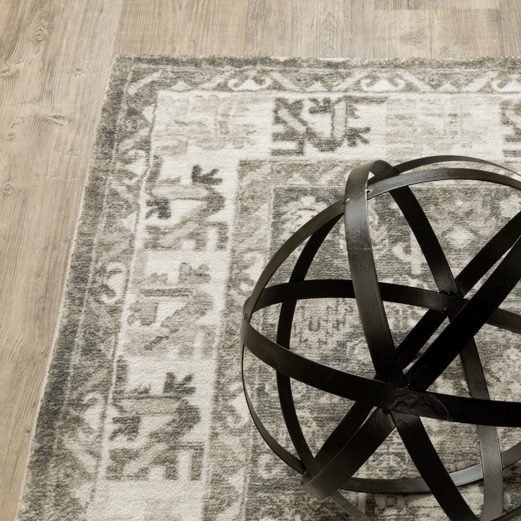 5" X 7" Grey Ivory Tan And Beige Oriental Power Loom Stain Resistant Area Rug
