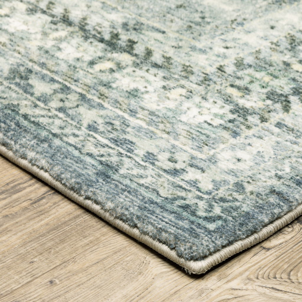 5" X 7" Blue Ivory And Grey Oriental Power Loom Stain Resistant Area Rug