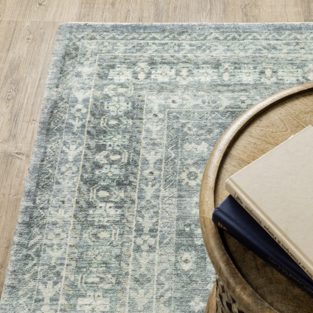 5" X 7" Blue Ivory And Grey Oriental Power Loom Stain Resistant Area Rug