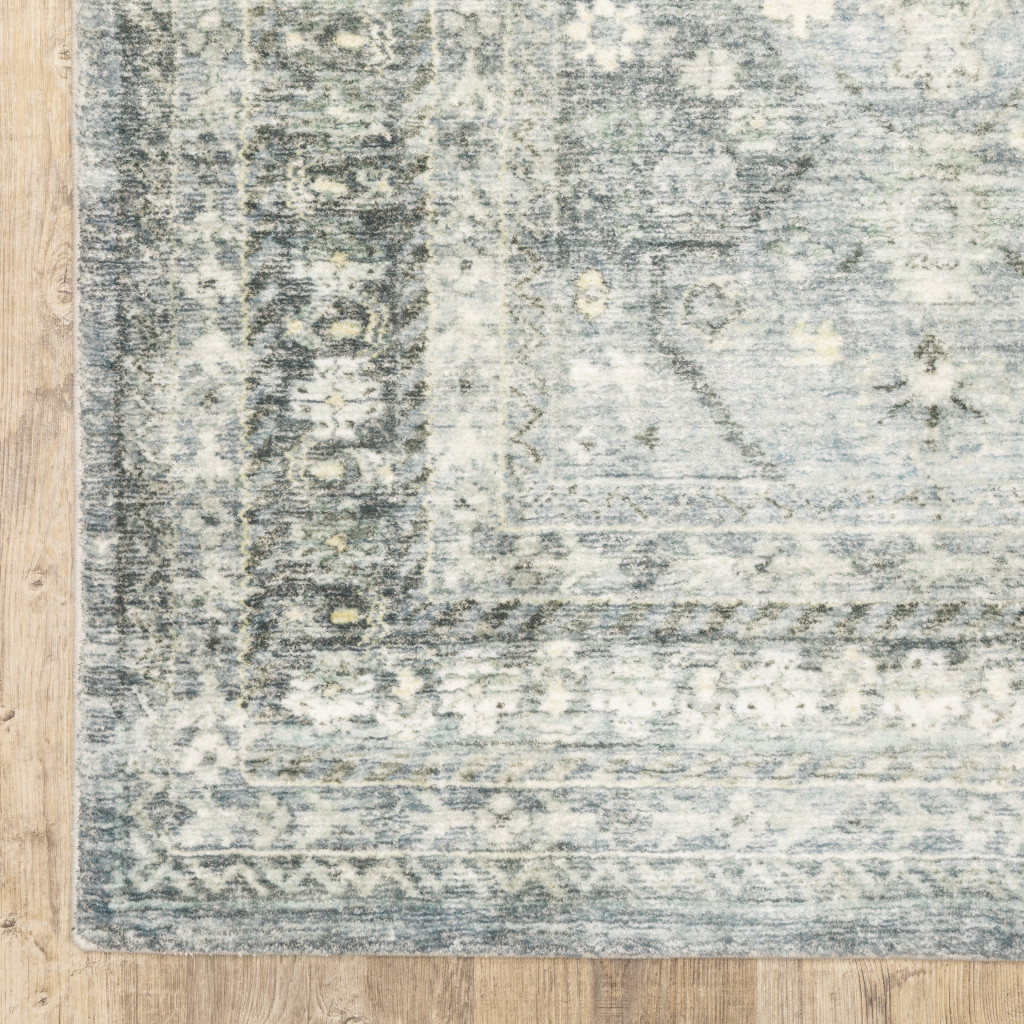 5" X 7" Blue Ivory And Grey Oriental Power Loom Stain Resistant Area Rug