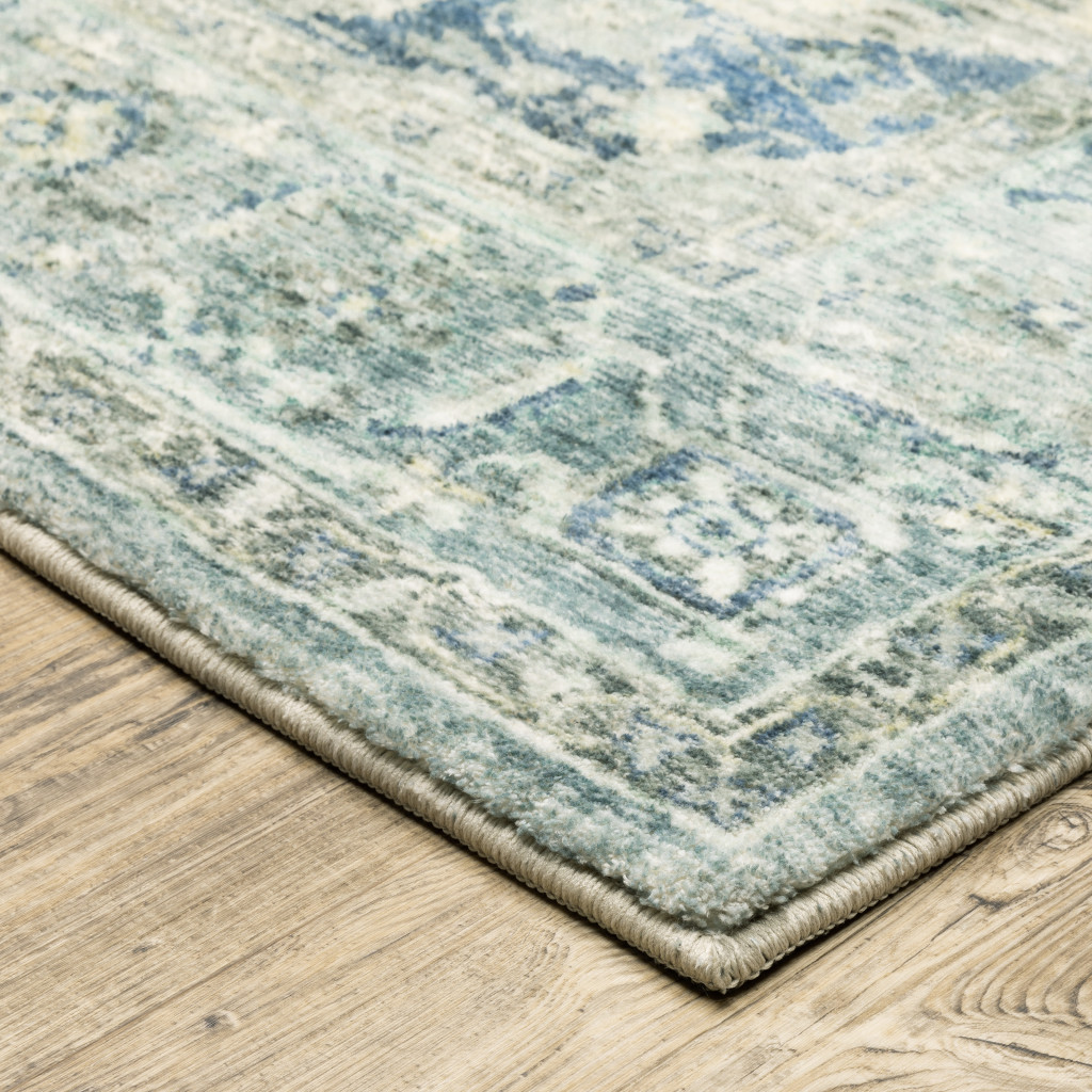 2" X 8" Grey Blue And Ivory Oriental Power Loom Stain Resistant Runner Rug