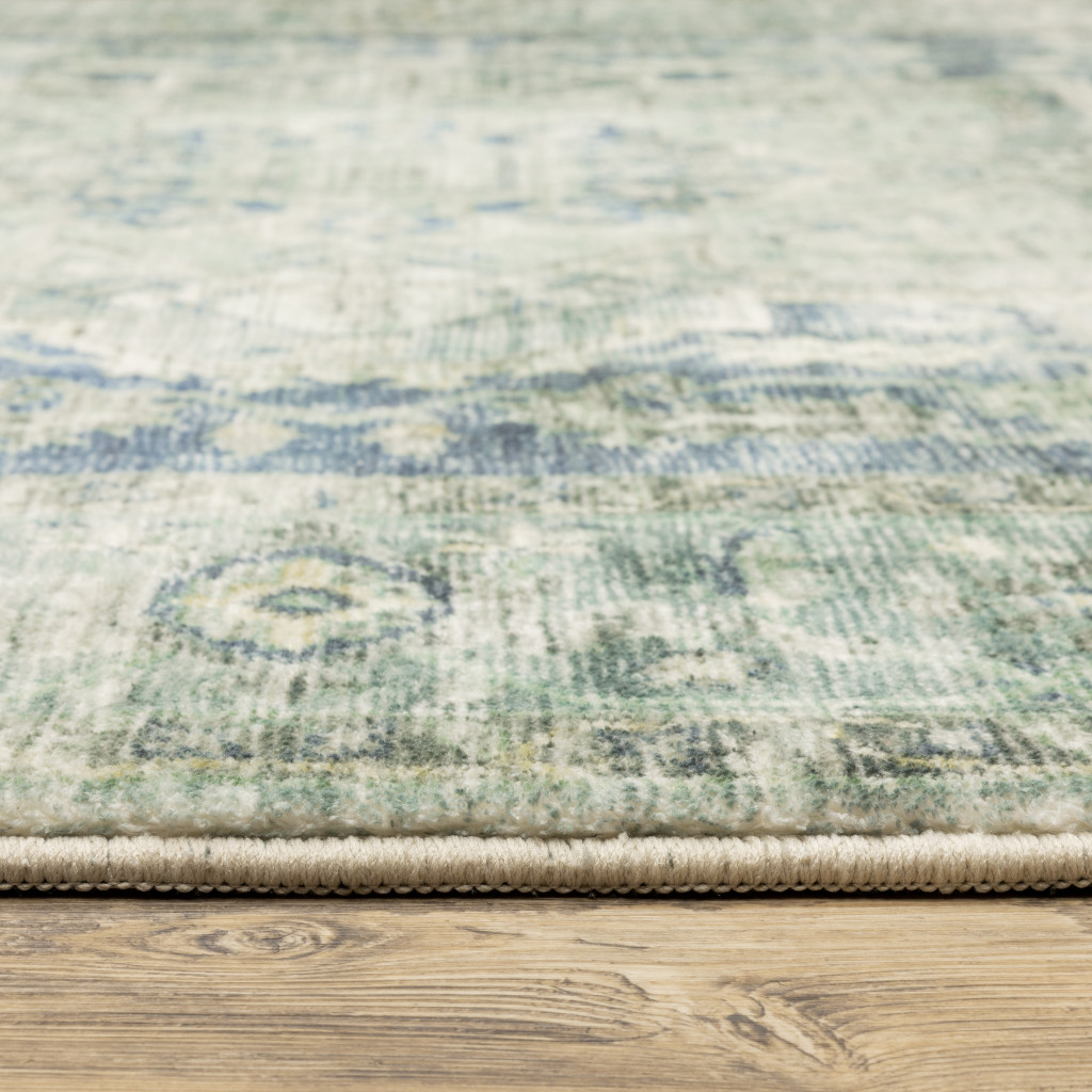 2" X 8" Grey Blue And Ivory Oriental Power Loom Stain Resistant Runner Rug