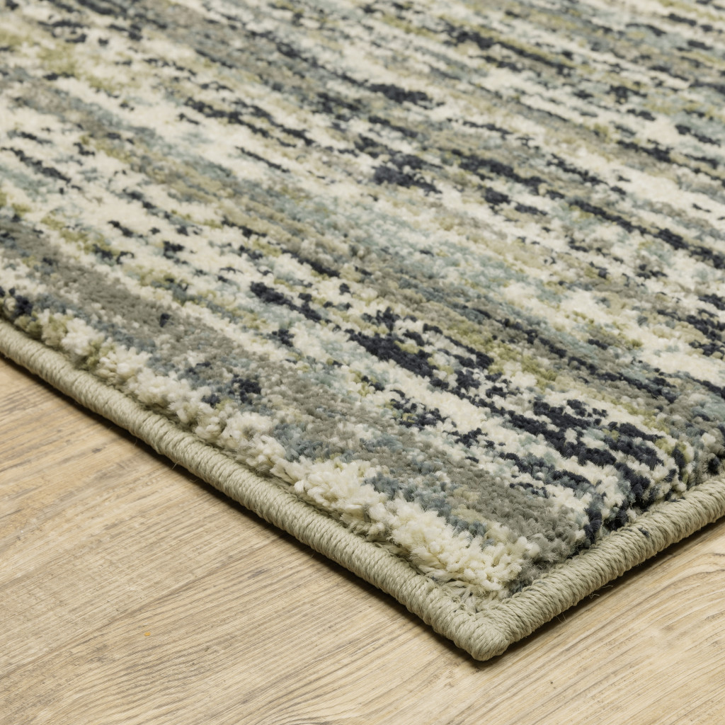 10" X 13" Blue Green Light Blue Grey And Ivory Abstract Power Loom Stain Resistant Area Rug