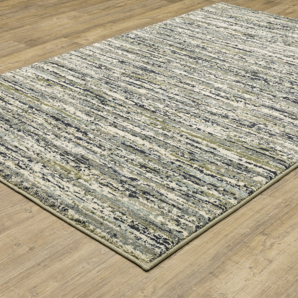 10" X 13" Blue Green Light Blue Grey And Ivory Abstract Power Loom Stain Resistant Area Rug