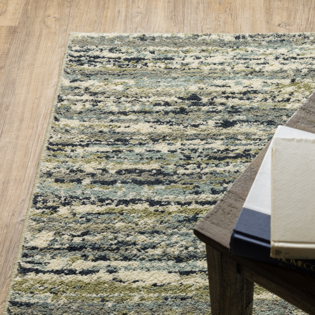 10" X 13" Blue Green Light Blue Grey And Ivory Abstract Power Loom Stain Resistant Area Rug