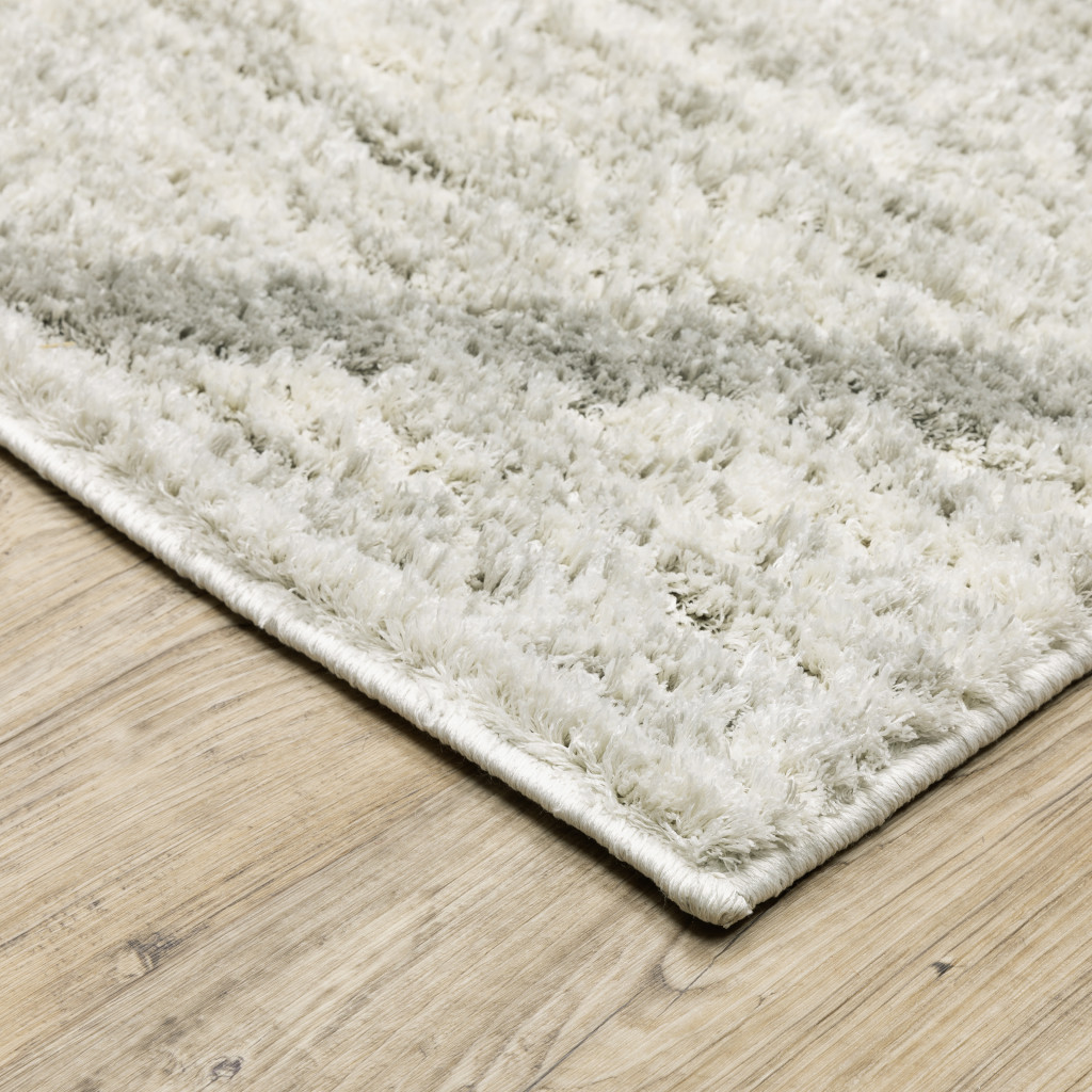 2" X 3" Ivory And Grey Geometric Shag Power Loom Stain Resistant Area Rug