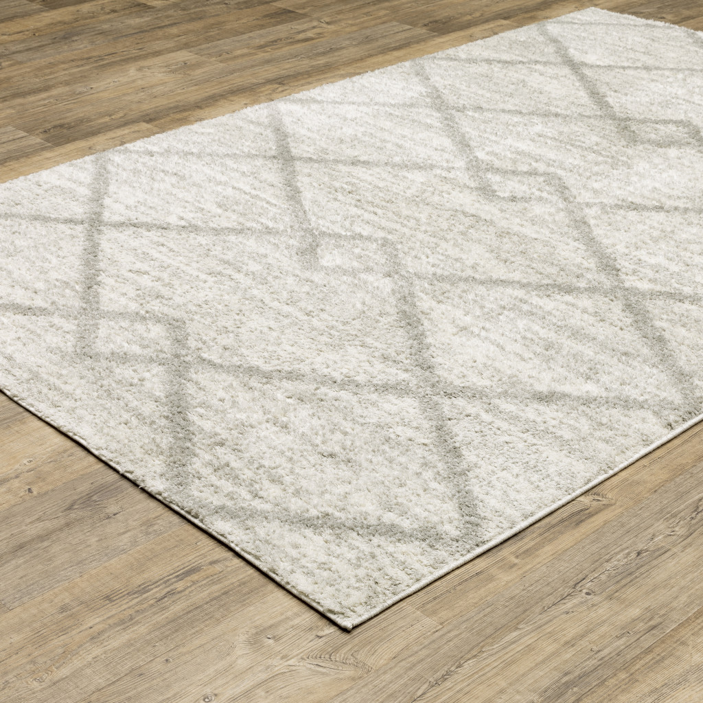 2" X 3" Ivory And Grey Geometric Shag Power Loom Stain Resistant Area Rug