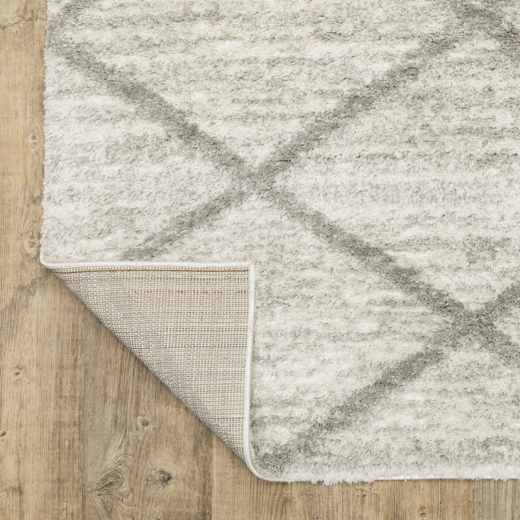 2" X 3" Ivory And Grey Geometric Shag Power Loom Stain Resistant Area Rug