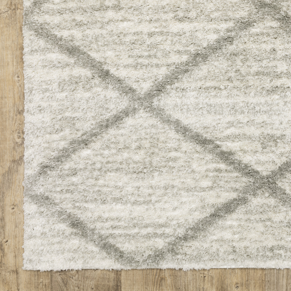 2" X 3" Ivory And Grey Geometric Shag Power Loom Stain Resistant Area Rug