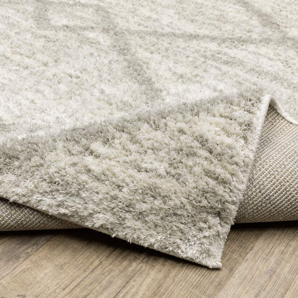 2" X 3" Ivory And Grey Geometric Shag Power Loom Stain Resistant Area Rug