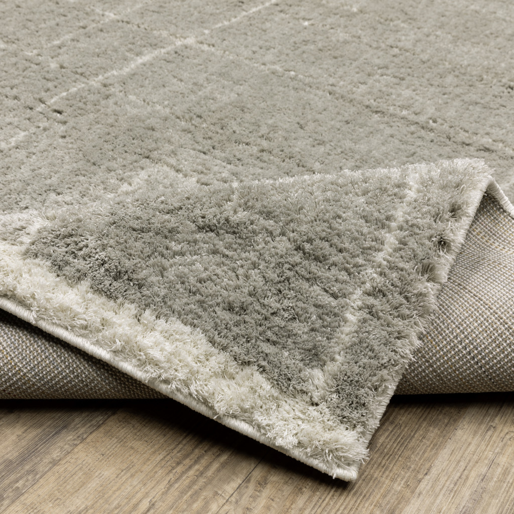 4" X 6" Grey And Ivory Geometric Shag Power Loom Stain Resistant Area Rug