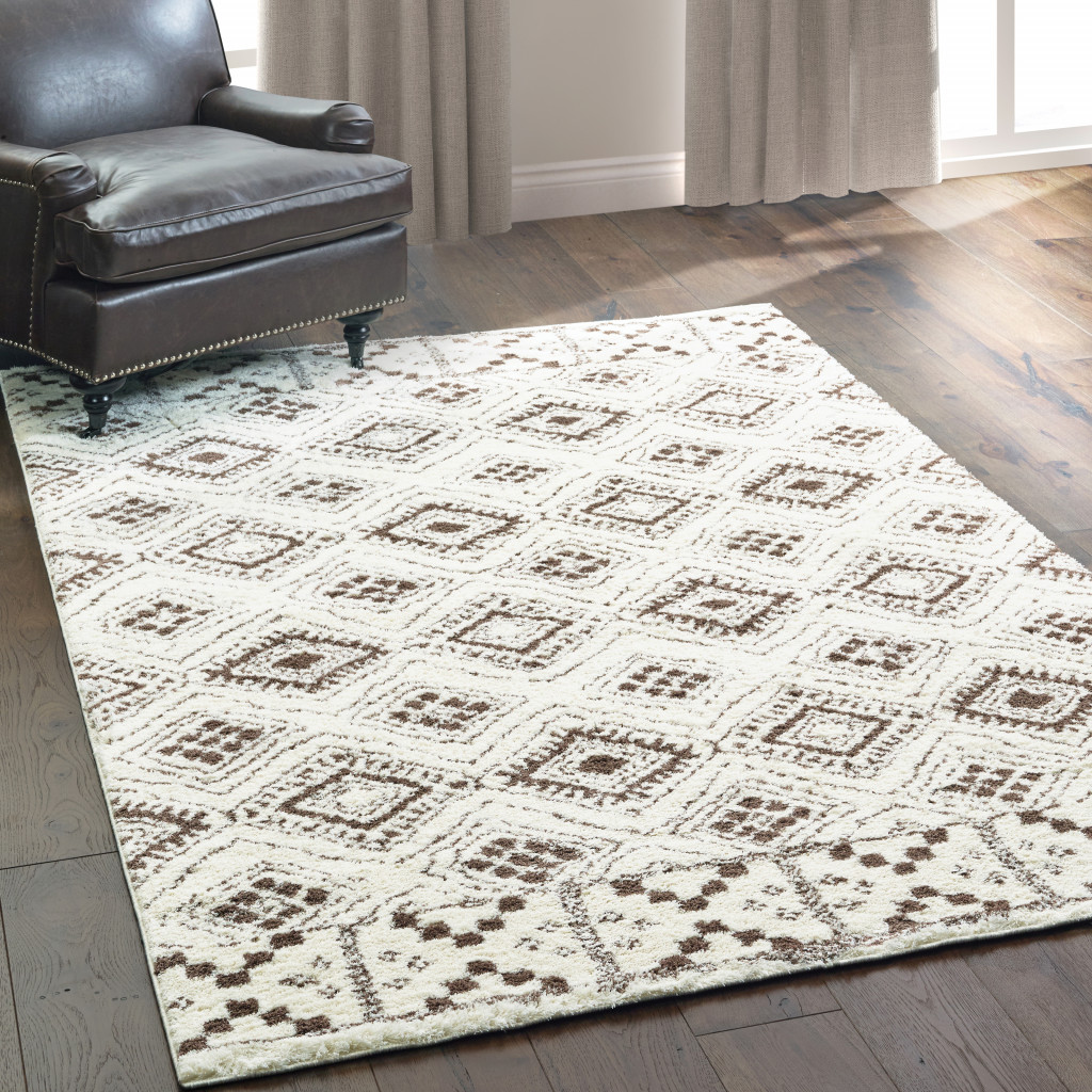 4" X 6" Ivory And Brown Geometric Shag Power Loom Stain Resistant Area Rug