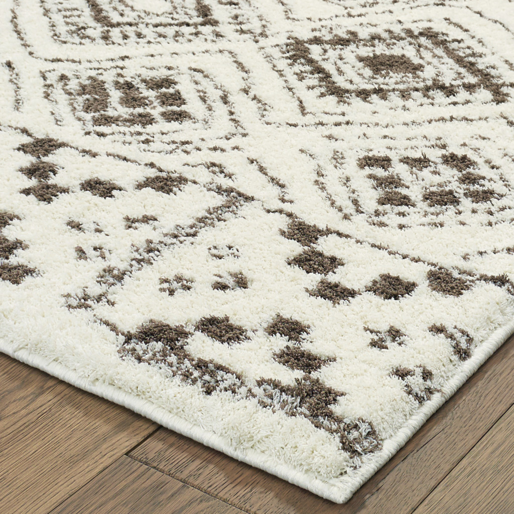 4" X 6" Ivory And Brown Geometric Shag Power Loom Stain Resistant Area Rug