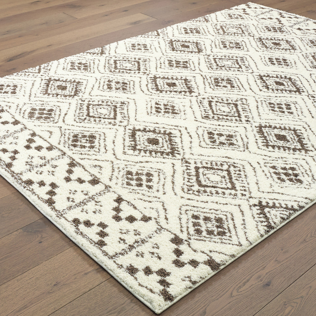 4" X 6" Ivory And Brown Geometric Shag Power Loom Stain Resistant Area Rug