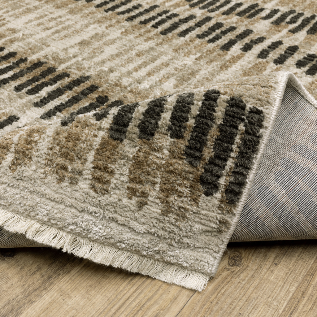 2" X 8" Beige Ivory Charcoal Brown Tan And Grey Abstract Power Loom Stain Resistant Runner Rug With Fringe