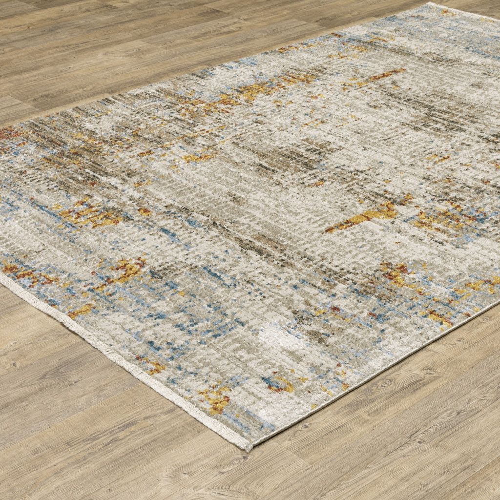 5" X 8" Beige Grey Brown Gold Red And Blue Abstract Power Loom Stain Resistant Area Rug With Fringe
