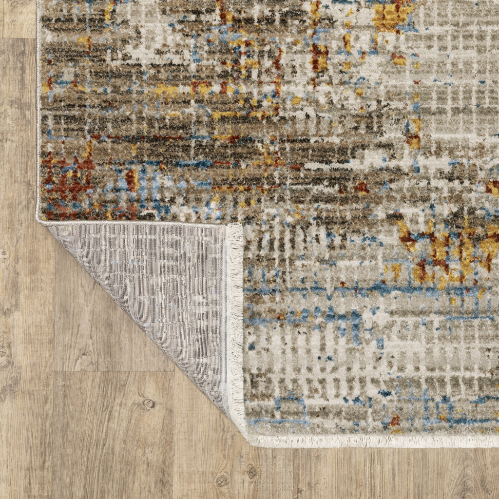 5" X 8" Beige Grey Brown Gold Red And Blue Abstract Power Loom Stain Resistant Area Rug With Fringe