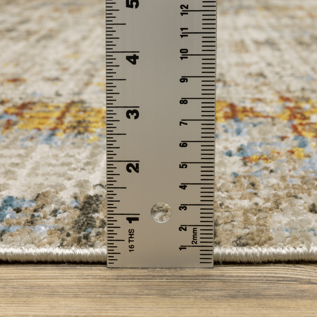 5" X 8" Beige Grey Brown Gold Red And Blue Abstract Power Loom Stain Resistant Area Rug With Fringe