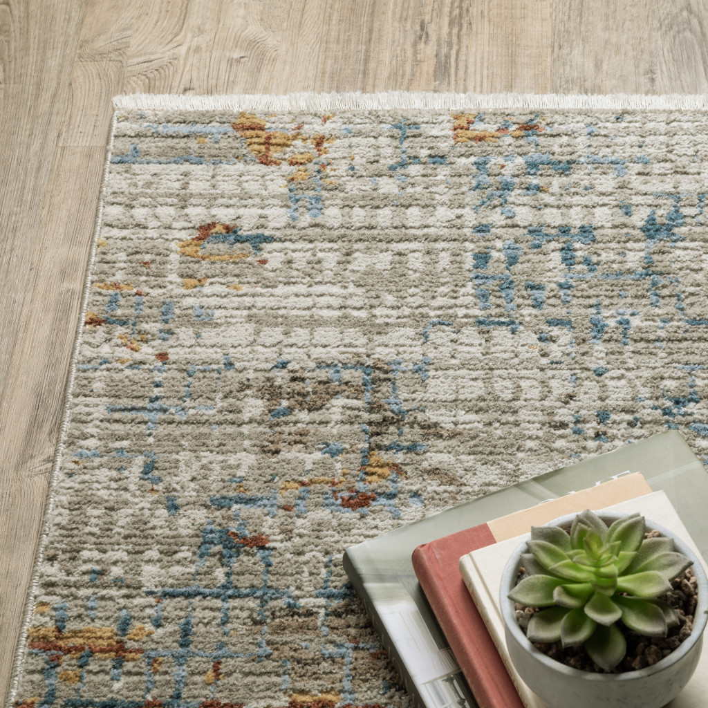 10" X 13" Beige Grey Brown Gold Red And Blue Abstract Power Loom Stain Resistant Area Rug With Fringe