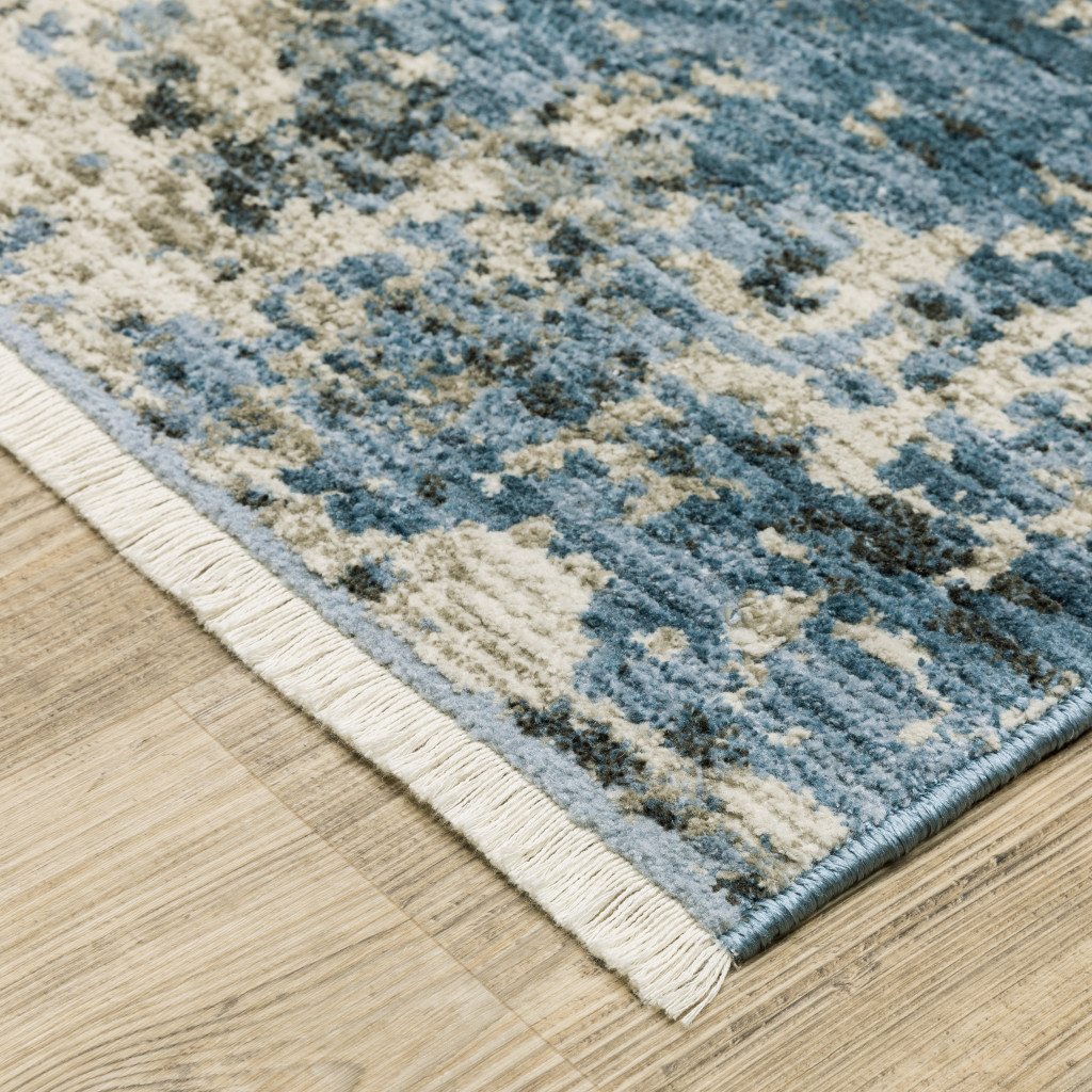 4" X 6" Blue Grey Ivory Light Blue And Dark Blue Abstract Power Loom Stain Resistant Area Rug With Fringe