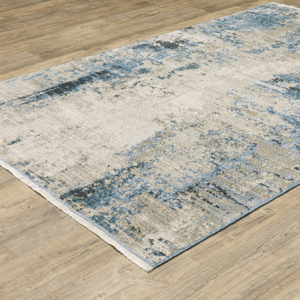 4" X 6" Blue Grey Ivory Light Blue And Dark Blue Abstract Power Loom Stain Resistant Area Rug With Fringe