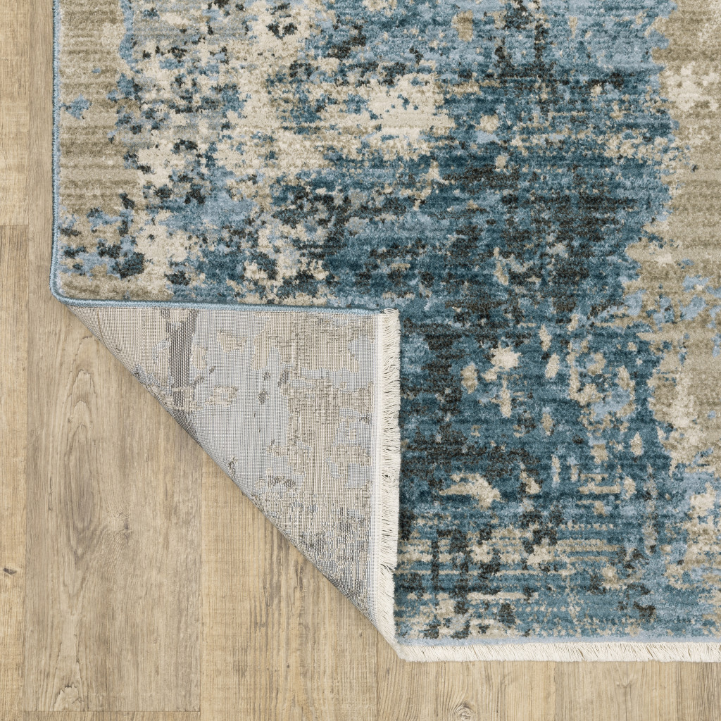 4" X 6" Blue Grey Ivory Light Blue And Dark Blue Abstract Power Loom Stain Resistant Area Rug With Fringe