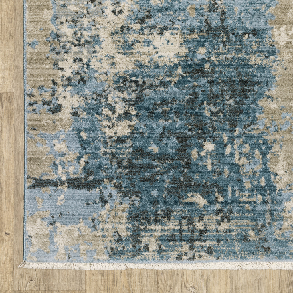 4" X 6" Blue Grey Ivory Light Blue And Dark Blue Abstract Power Loom Stain Resistant Area Rug With Fringe
