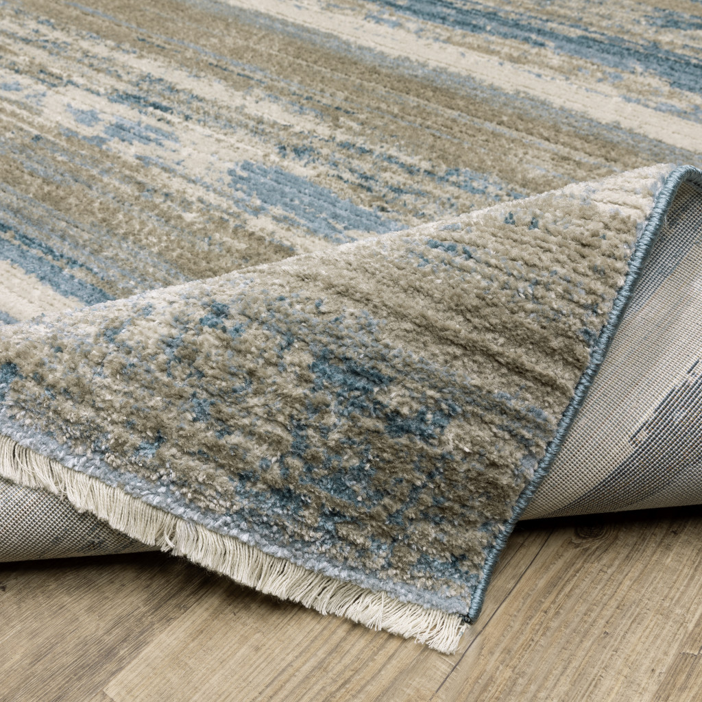 2" X 8" Blue And Ivory Abstract Power Loom Runner Rug With Fringe