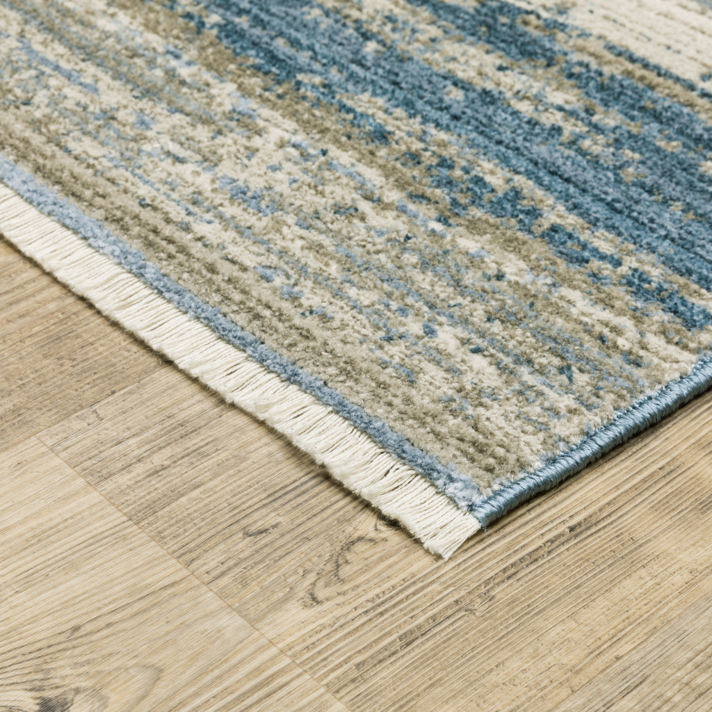 8" X 11" Ivory Beige Grey Blue And Tan Abstract Power Loom Stain Resistant Area Rug With Fringe