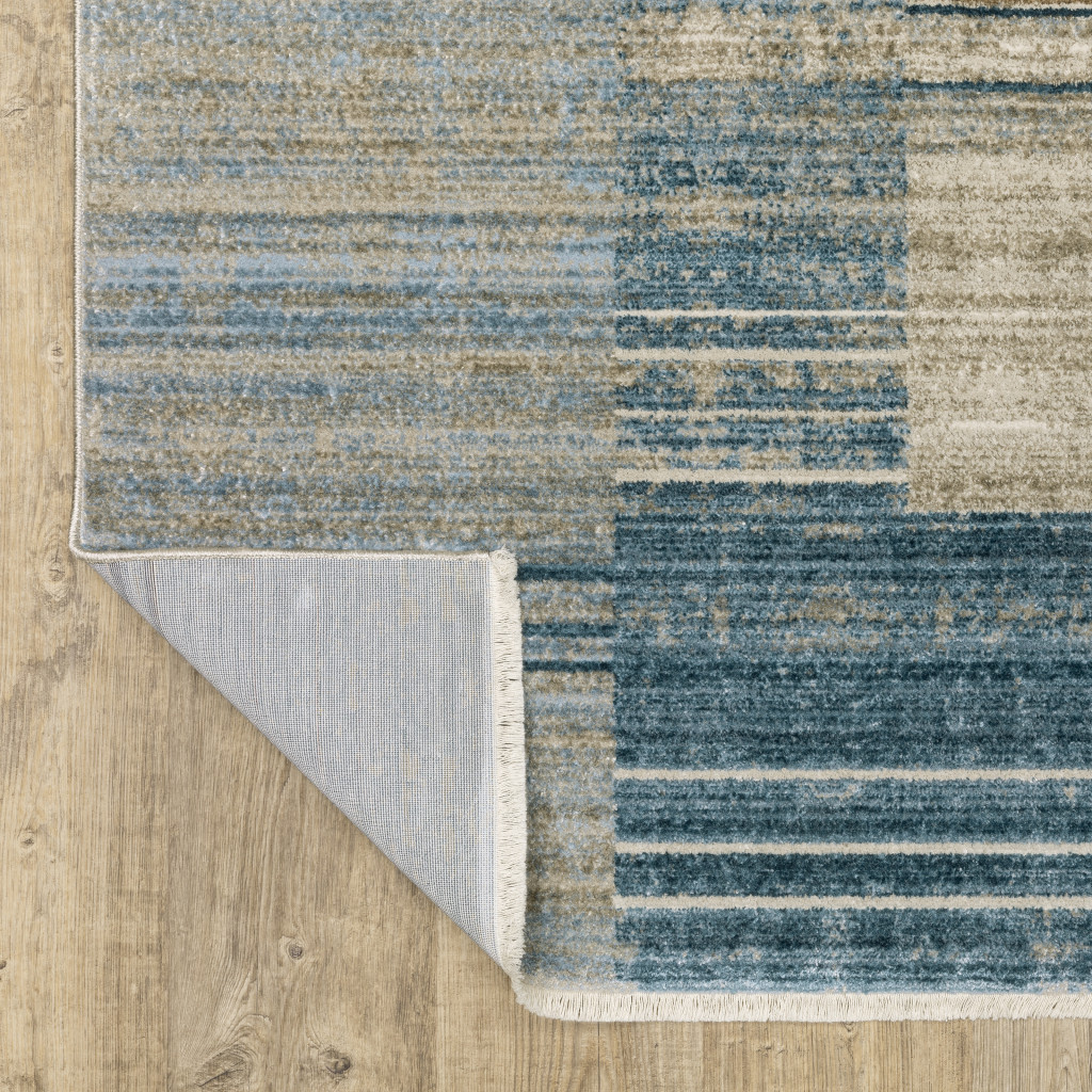 4" X 6" Blue Dark Blue Teal Grey Ivory Beige And Tan Geometric Power Loom Stain Resistant Area Rug With Fringe