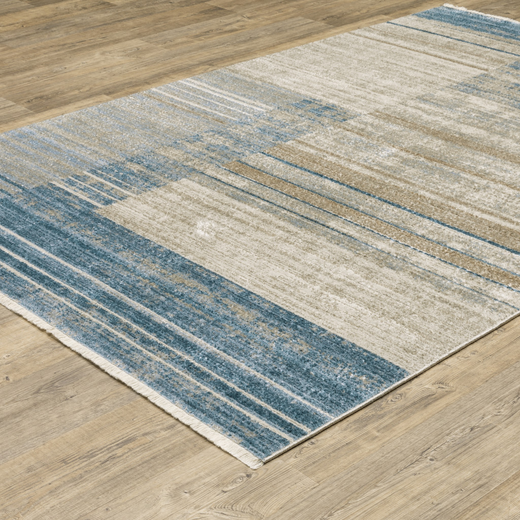 5" X 8" Blue Dark Blue Teal Grey Ivory Beige And Tan Geometric Power Loom Stain Resistant Area Rug With Fringe
