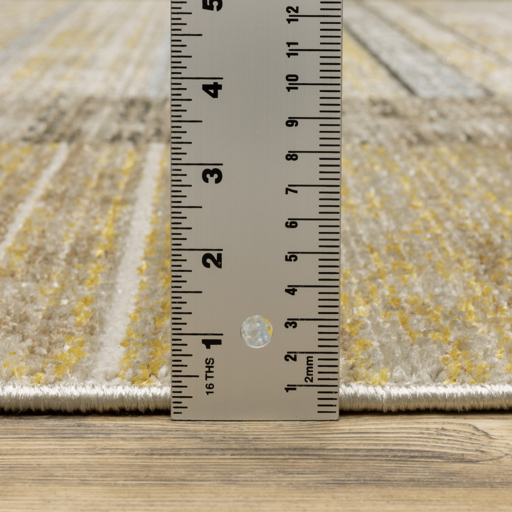 5" X 8" Beige Charcoal Brown Grey Tan Gold And Blue Geometric Power Loom Stain Resistant Area Rug With Fringe