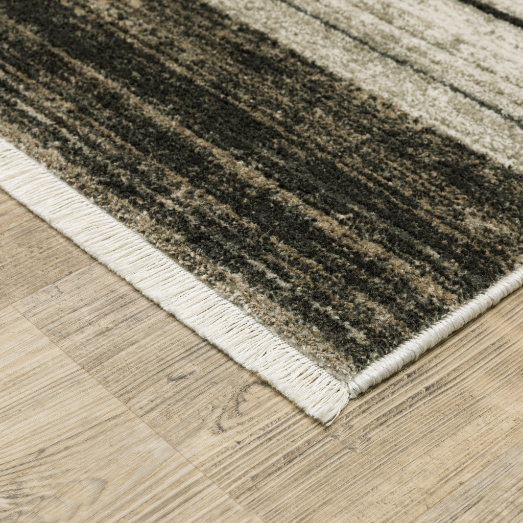 6" X 9" Beige Charcoal Brown Grey Tan Gold And Blue Geometric Power Loom Stain Resistant Area Rug With Fringe