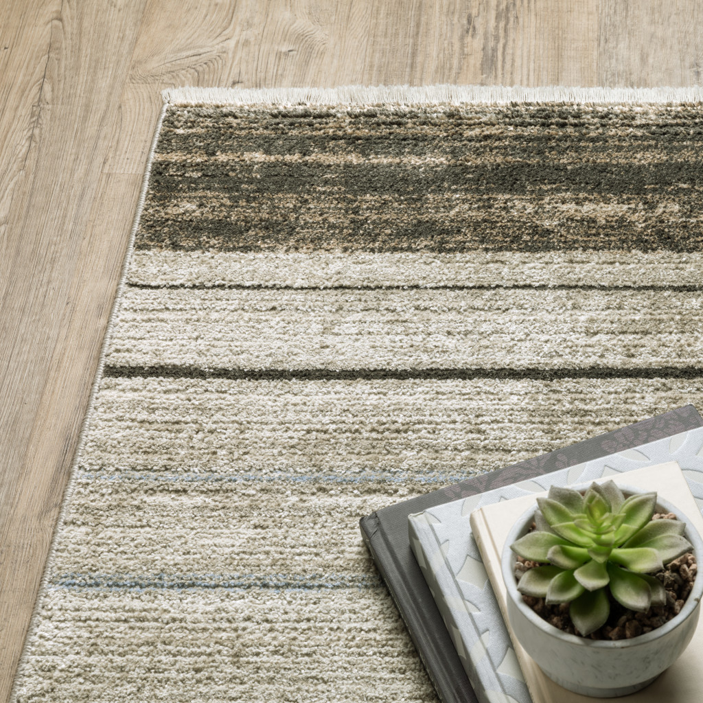 6" X 9" Beige Charcoal Brown Grey Tan Gold And Blue Geometric Power Loom Stain Resistant Area Rug With Fringe